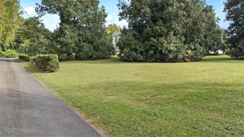 148 Simmons Street Trion, GA 30753 - Photo 17 of 73 a view of yard with swimming pool and trees in the background