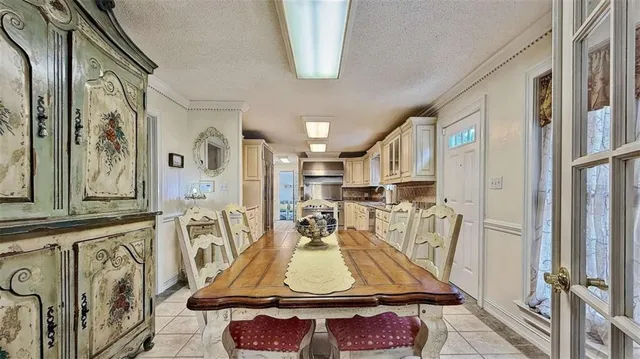 a living room with furniture and flowers