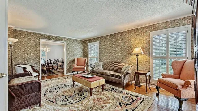 a view of entryway and dining room with furniture