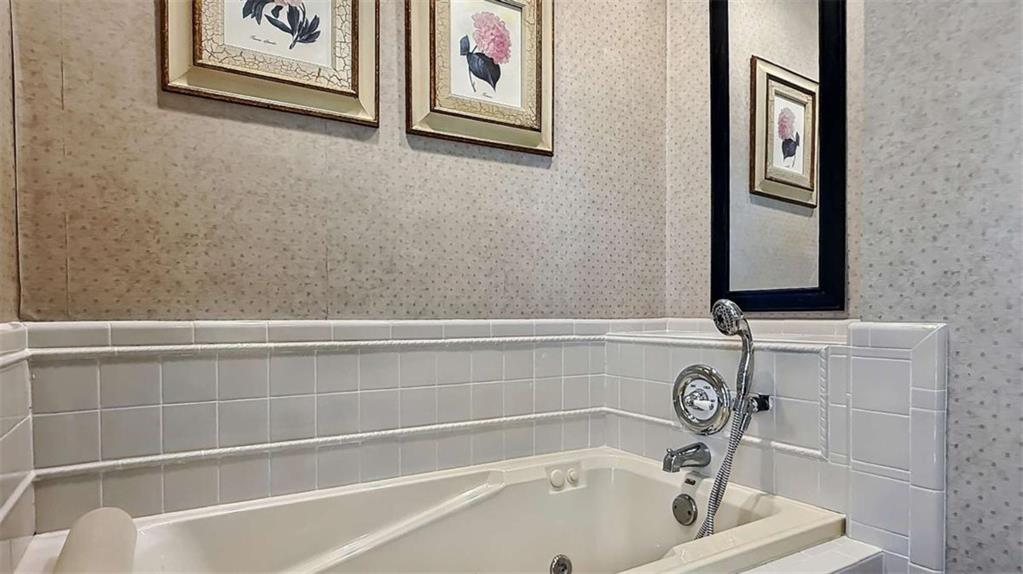 148 Simmons Street Trion, GA 30753 - Photo 47 of 73 a bathroom with a bathtub and a window