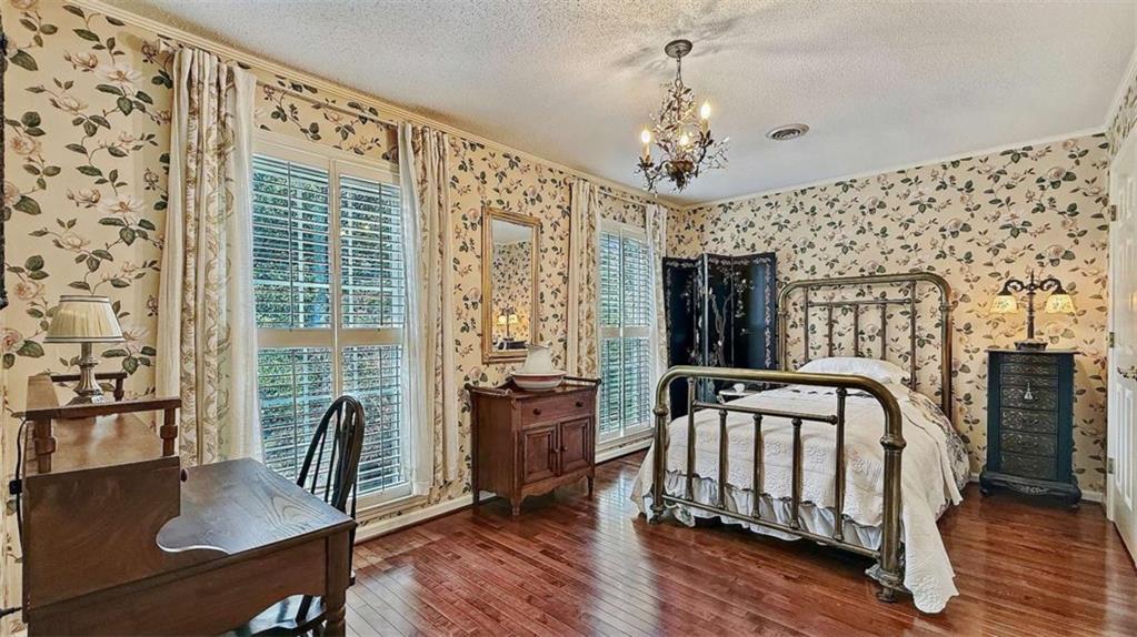 148 Simmons Street Trion, GA 30753 - Photo 49 of 73 a view of a bedroom with furniture window and wooden floor