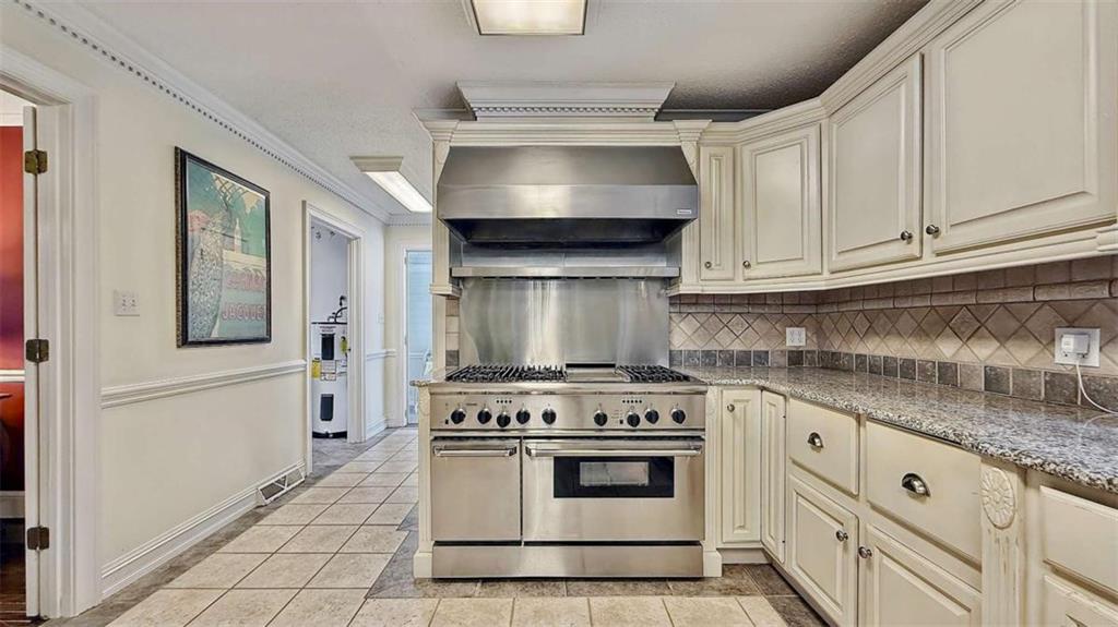 148 Simmons Street Trion, GA 30753 - Photo 8 of 73 a kitchen with white cabinets and appliances
