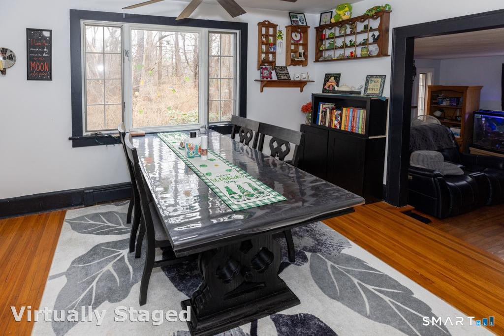 36 Music Vale Road Salem, CT 06420 - Photo 10 of 38 The dining area leads to a sunken living room with fireplace . .