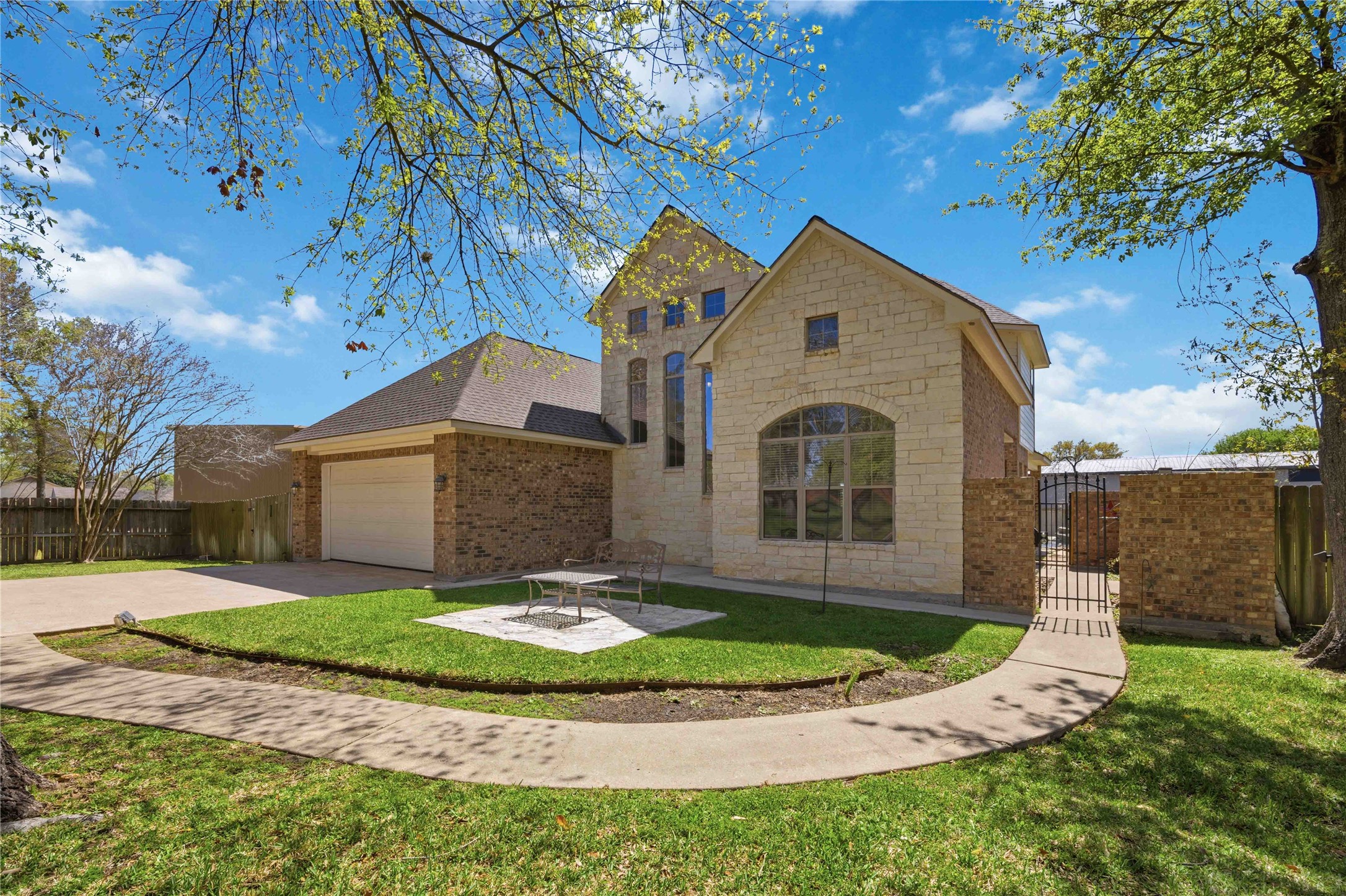 1930 Old River Road Montgomery, TX 77356 - Photo 4 of 49 A winding sidewalk offers a great view of the stylish brick and stone façade, as it leads to a side gate and entry to the home.