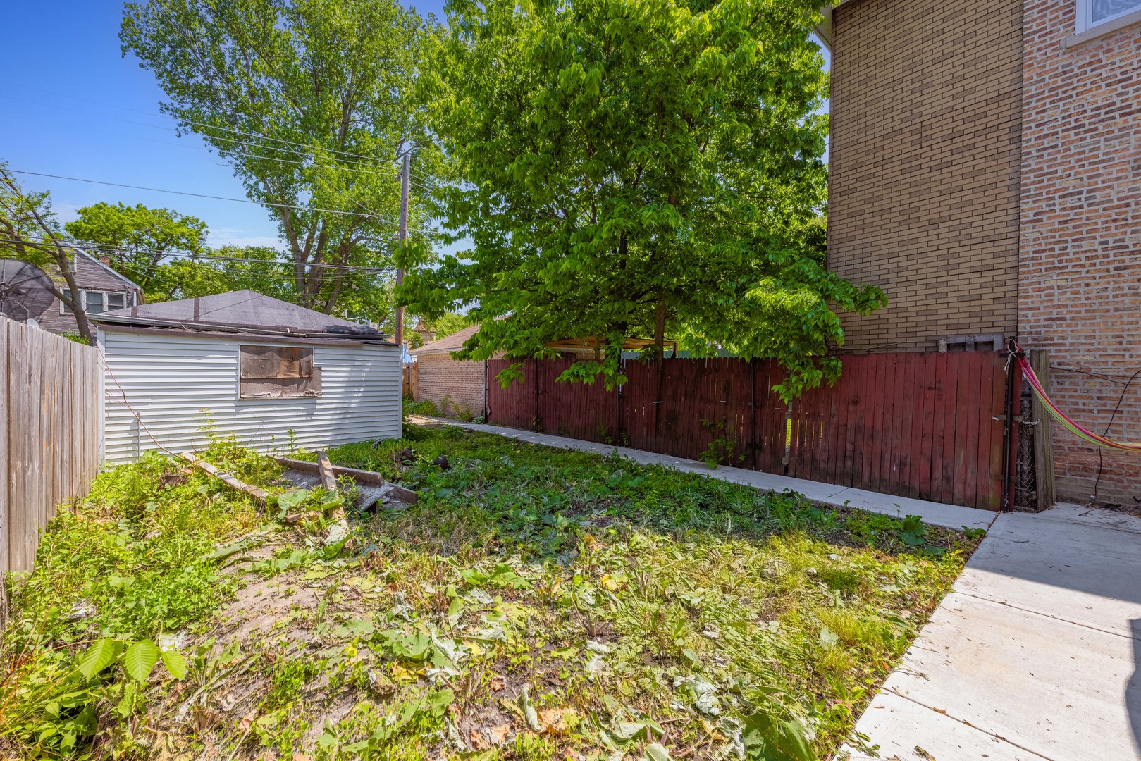5247 South May Street Chicago, IL 60609 - Photo 20 of 23 a backyard of a house