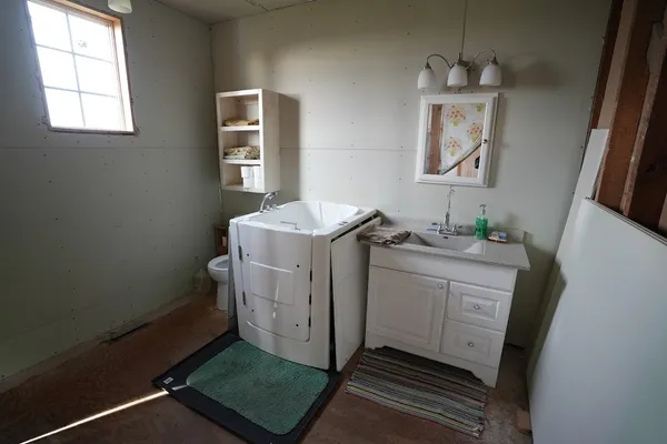 a utility room with closet dryer and washer