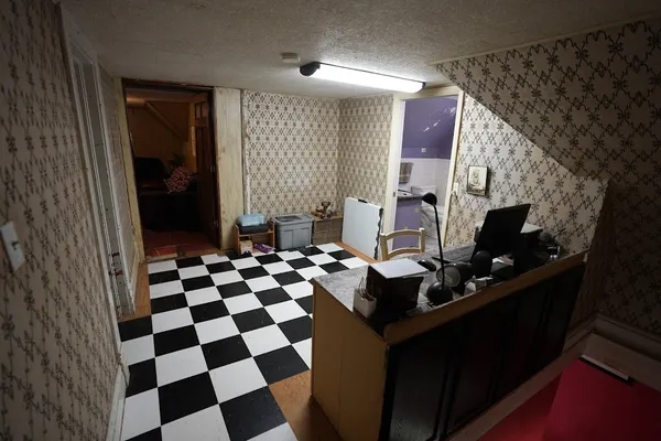 a room with black and white cabinets
