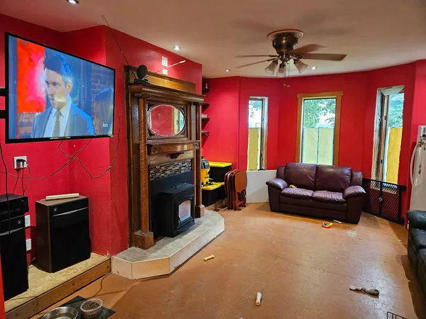 a living room with furniture and a flat screen tv