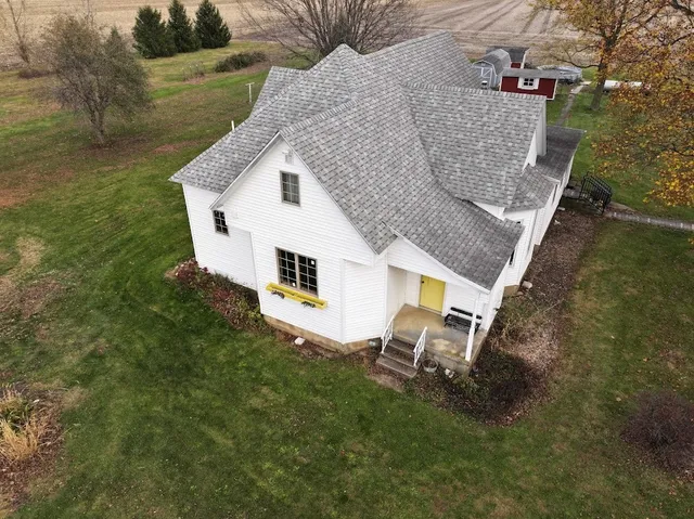 a aerial view of a house with a yard