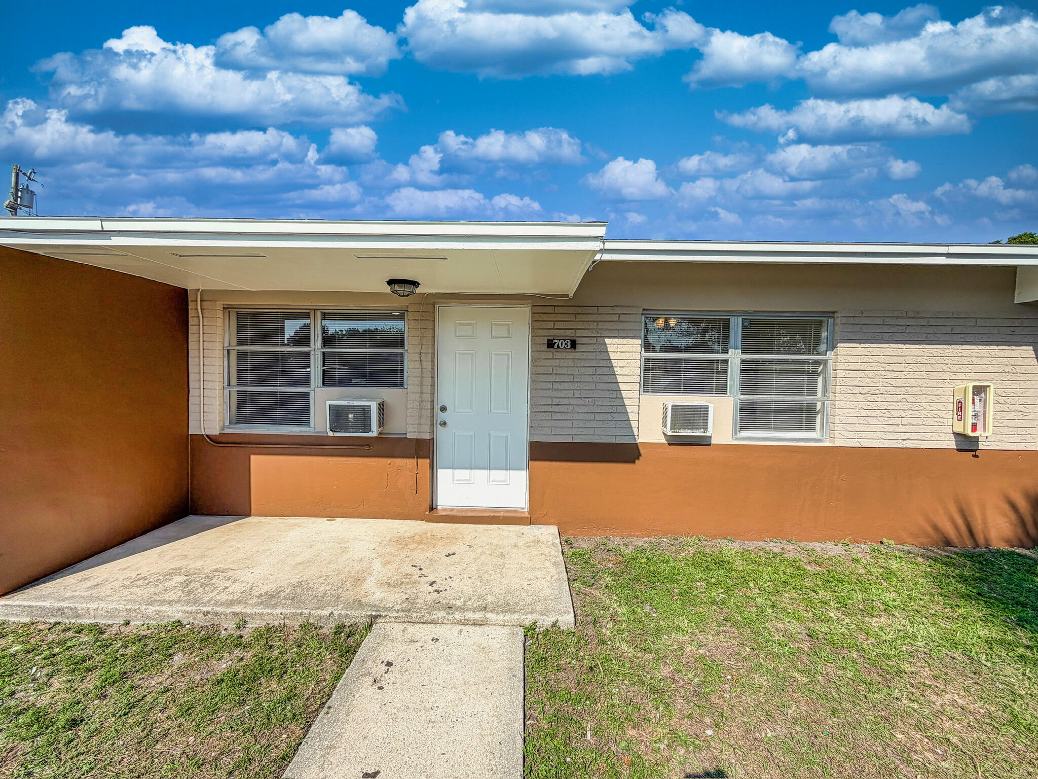 703 North 25th Street Fort Pierce, FL 34947 - Photo 16 of 16 a front view of a house with a yard