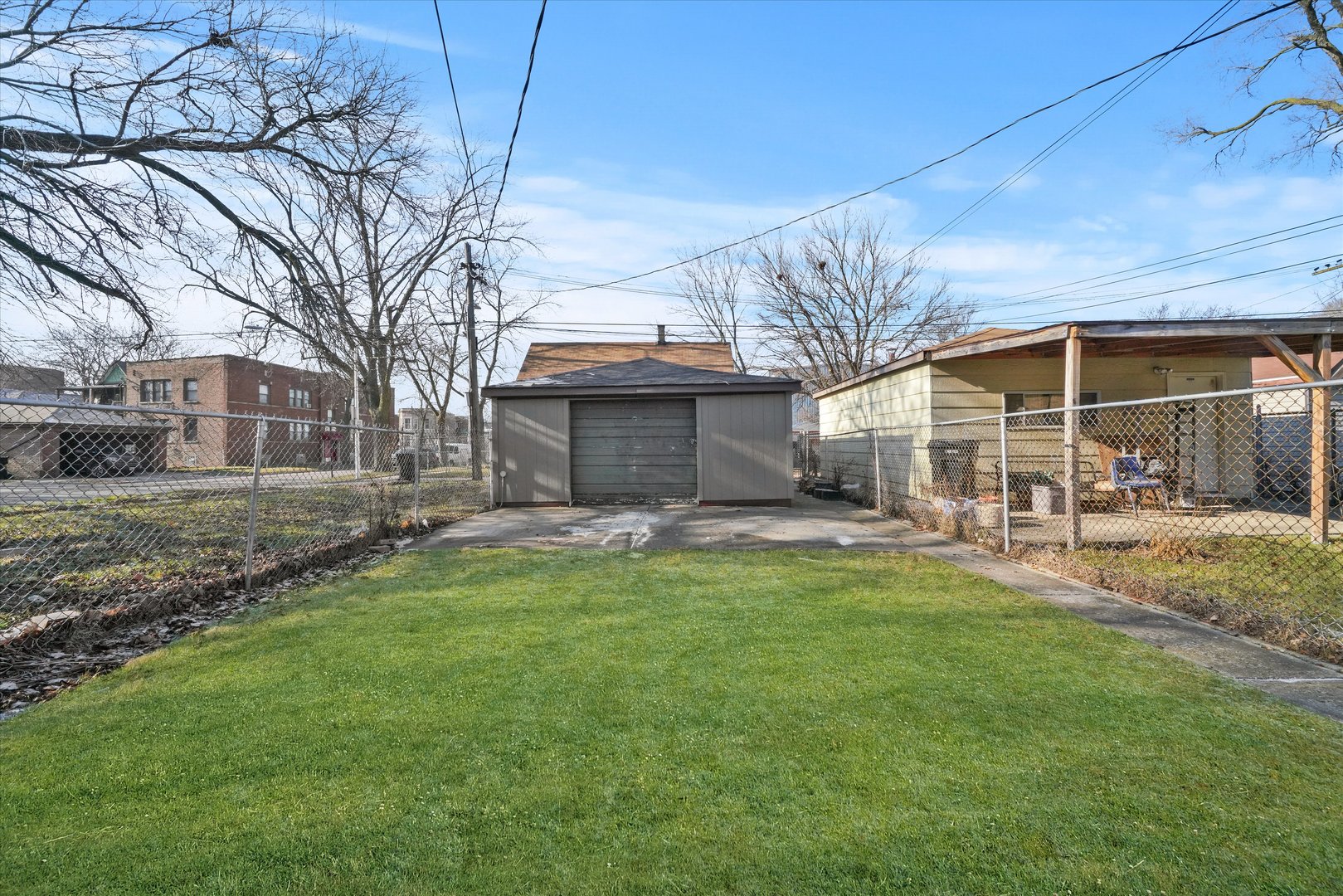 7356 South Kenwood Avenue Chicago, IL 60619 - Photo 25 of 27 a view of a house with a yard