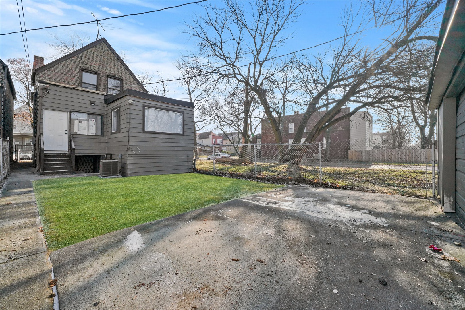 7356 South Kenwood Avenue Chicago, IL 60619 - Photo 27 of 27 a view of a yard in front of a house