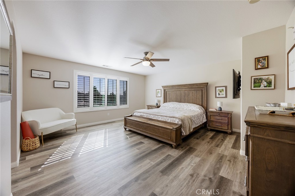 33345 Wallace Way Yucaipa, CA 92399 - Photo 22 of 38 a spacious bedroom with a bed and a window