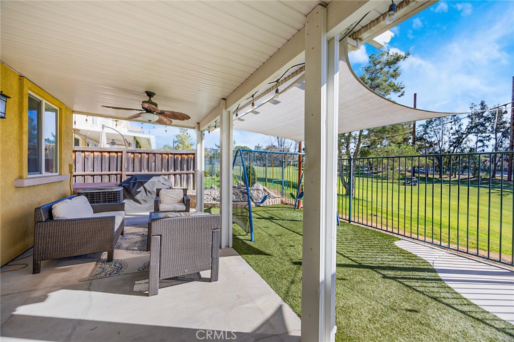 33345 Wallace Way Yucaipa, CA 92399 - Photo 33 of 38 a view of a porch with couches potted plants with wooden floor