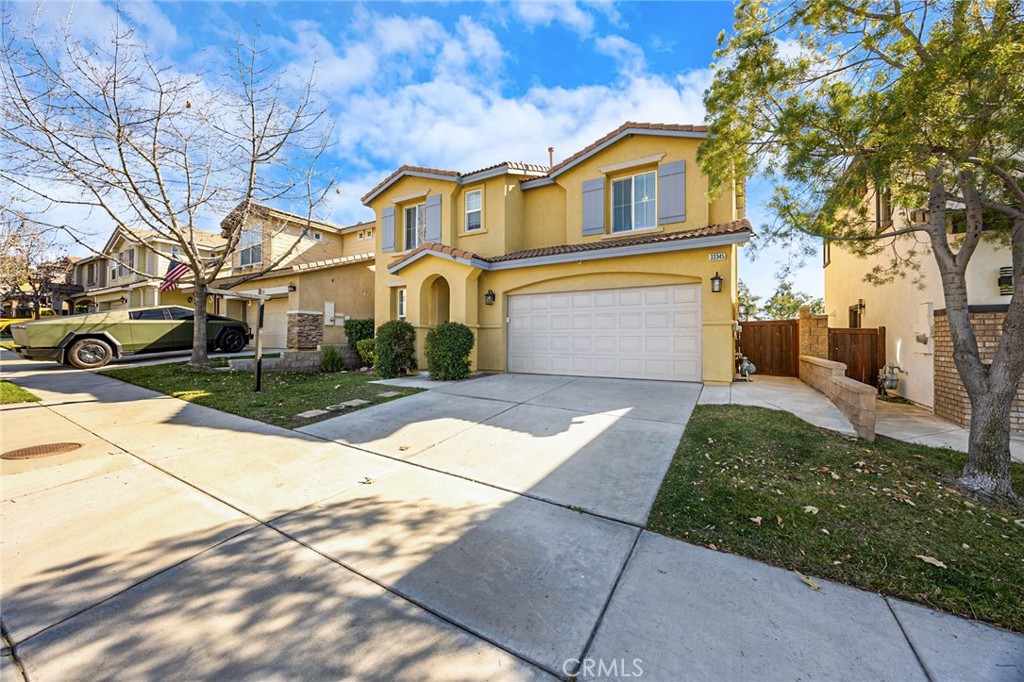 33345 Wallace Way Yucaipa, CA 92399 - Photo 6 of 38 a front view of a house with a yard