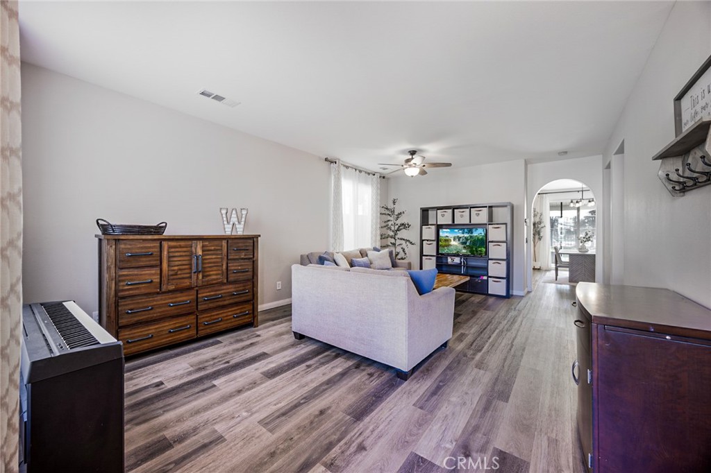33345 Wallace Way Yucaipa, CA 92399 - Photo 9 of 38 a living room with furniture and wooden floor