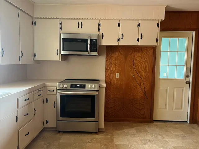 a view of a kitchen with washer and dryer
