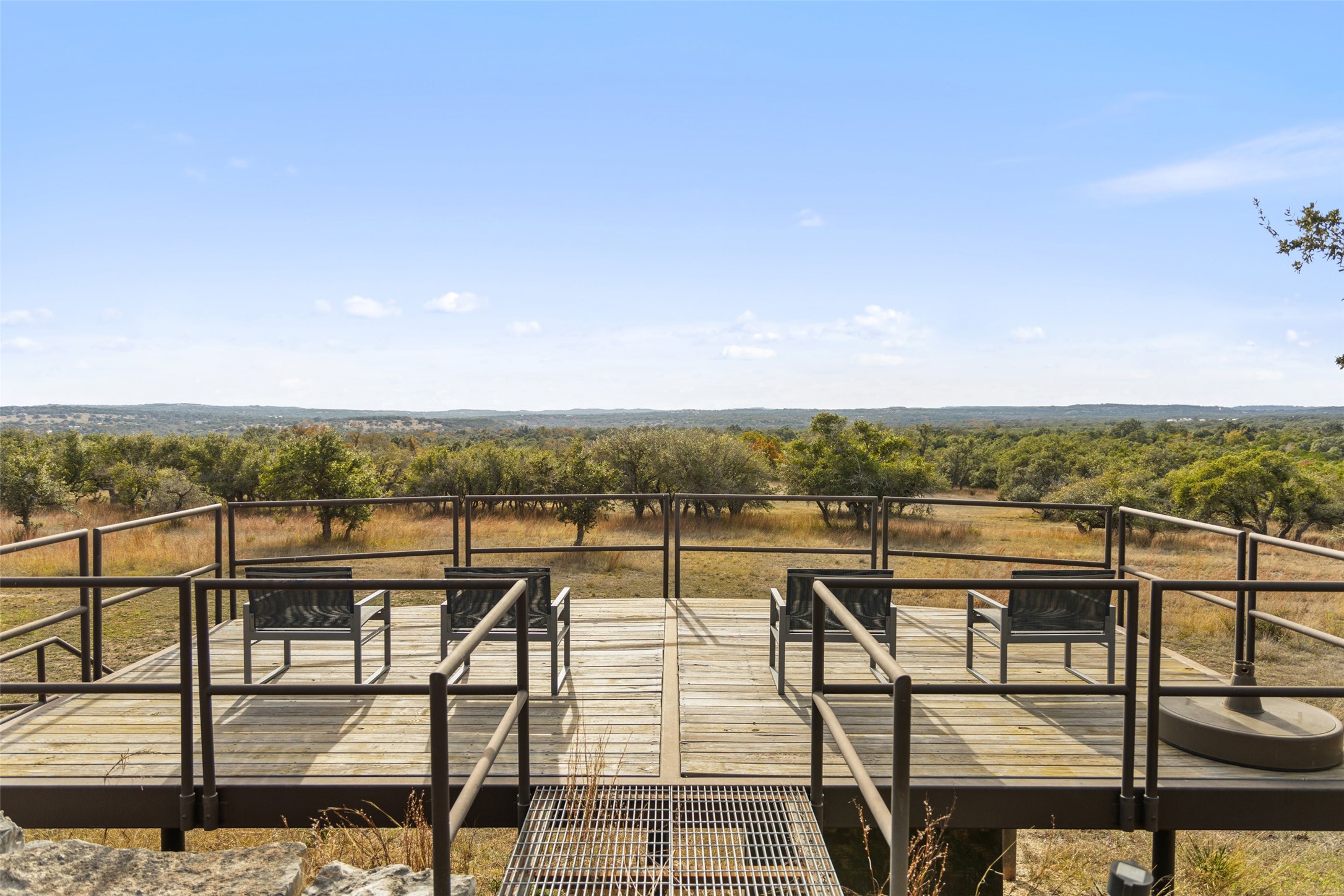 751 Prochnow Road Dripping Springs, TX 78620 - Photo 20 of 40 Wooden terrace with a rural view