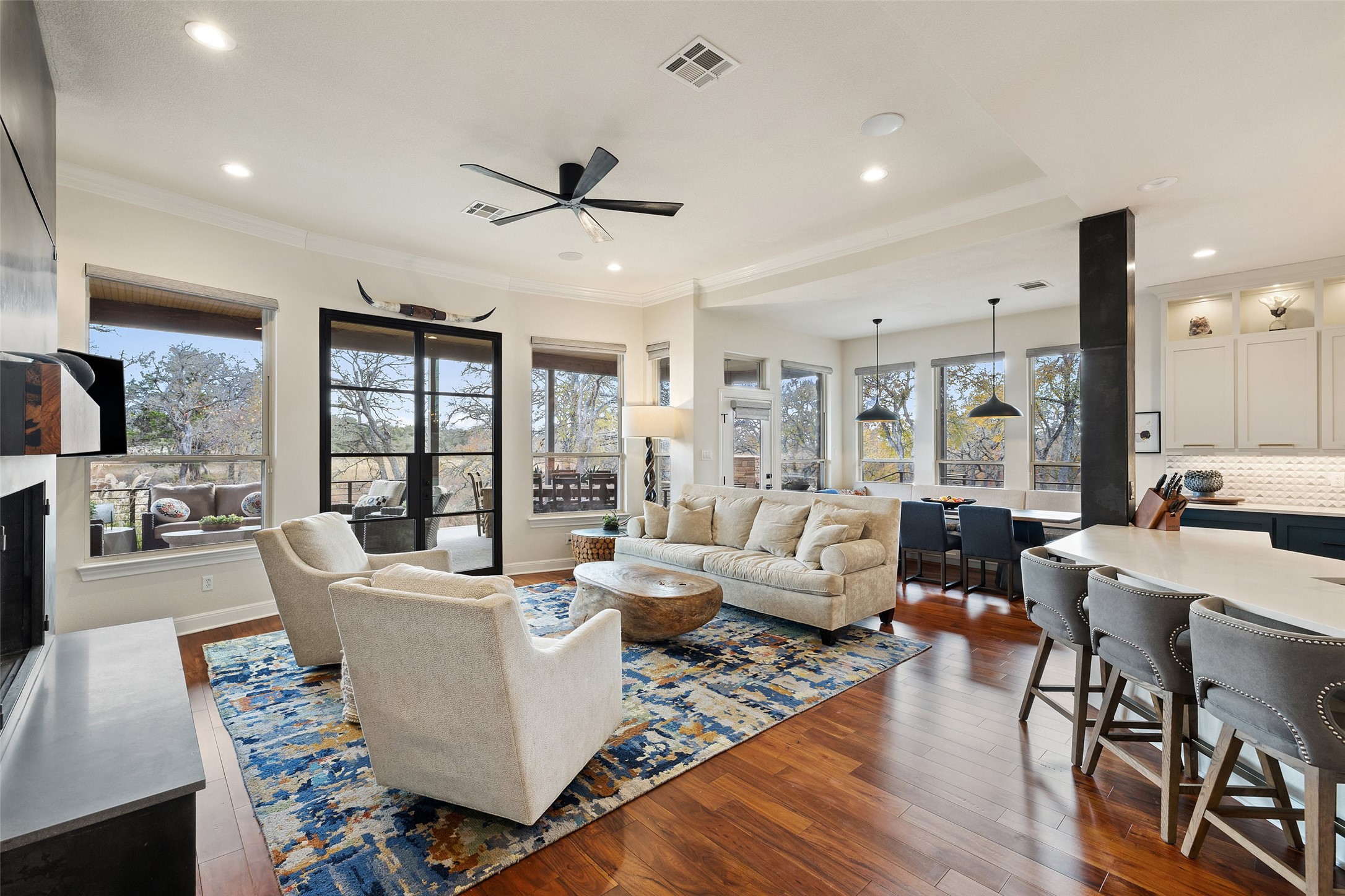 751 Prochnow Road Dripping Springs, TX 78620 - Photo 8 of 40 Living room with crown molding, dark hardwood / wood-style floors, and ceiling fan