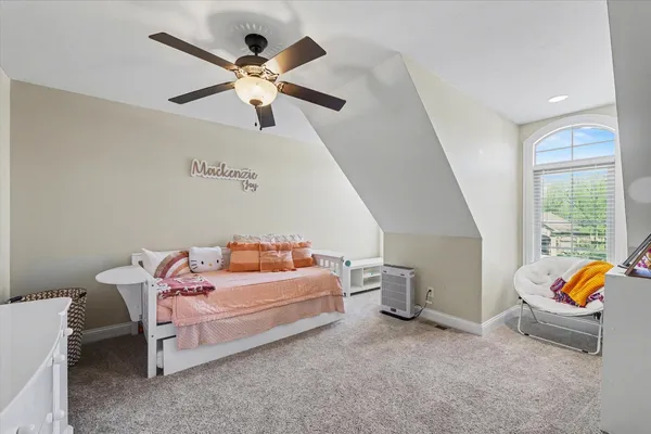 a bedroom with furniture and window