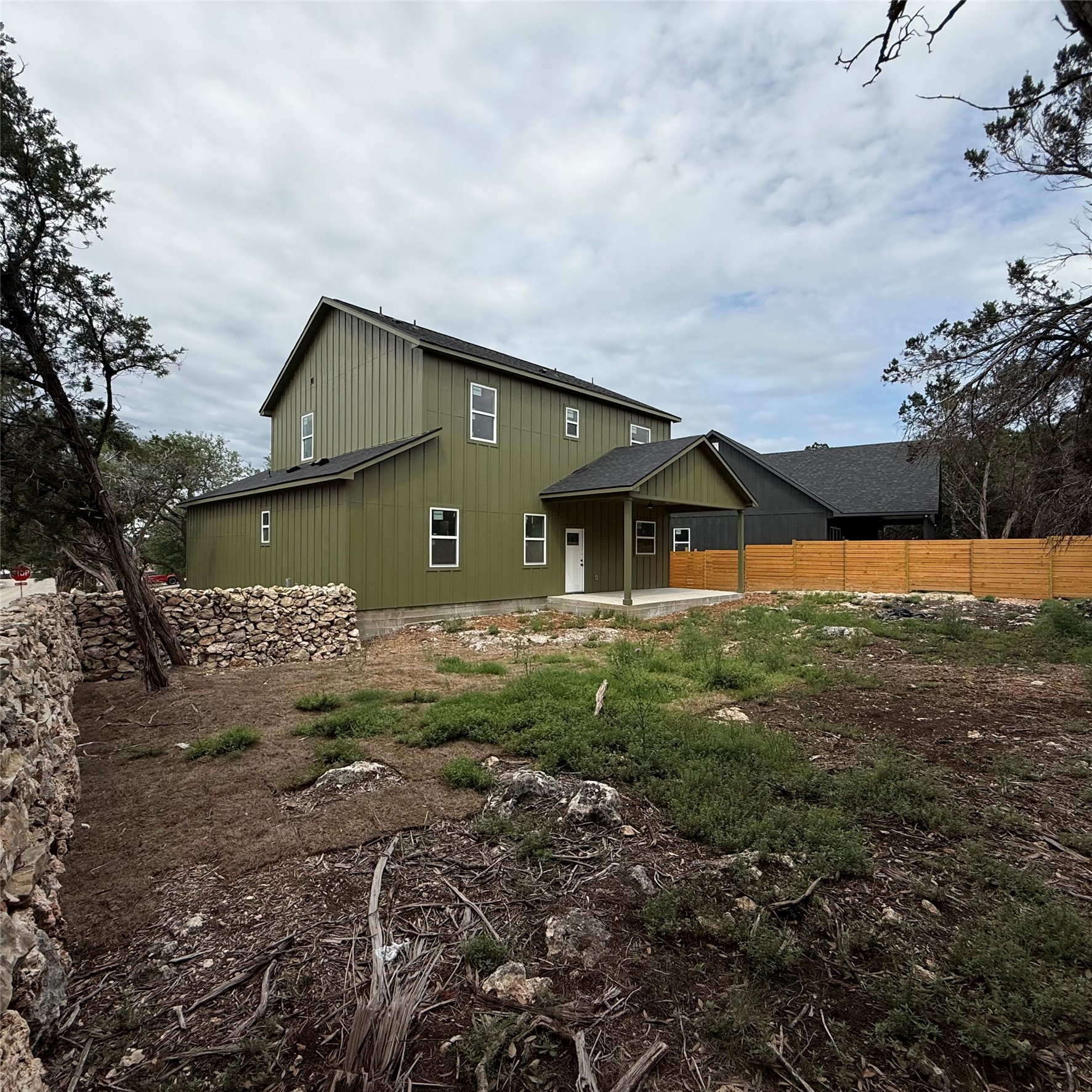 118 Crazy Cross Road Wimberley, TX 78676 - Photo 3 of 18 a view of a house with a yard