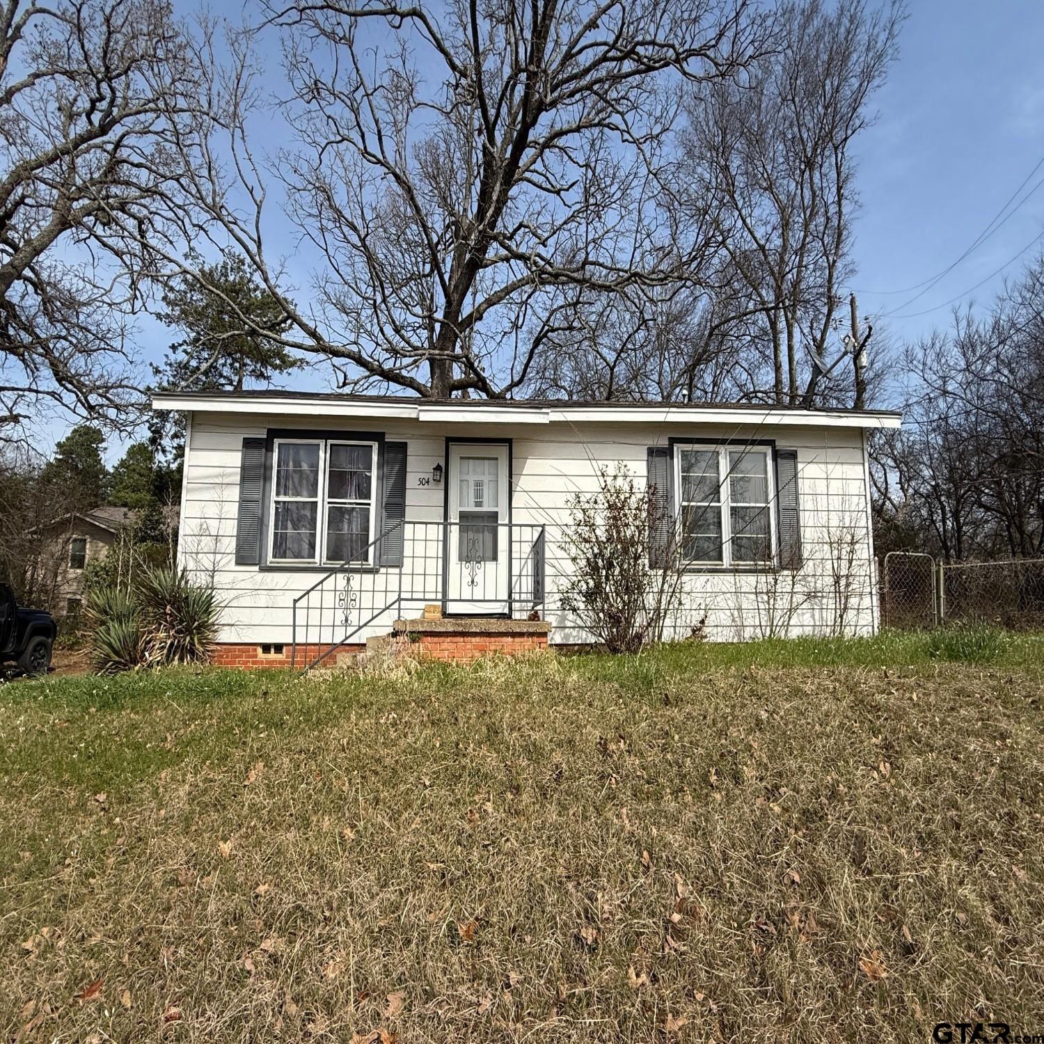front view of a house with a yard