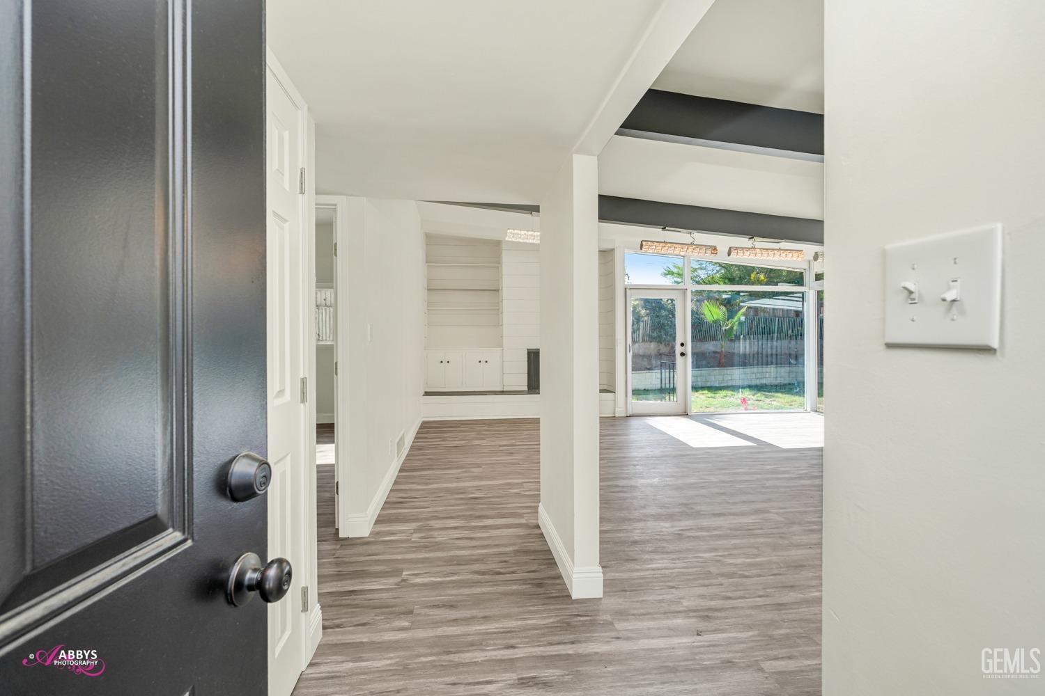 Undisclosed Address Bakersfield, CA 93306 - Photo 16 of 32 a view of a hallway with wooden floor and staircase