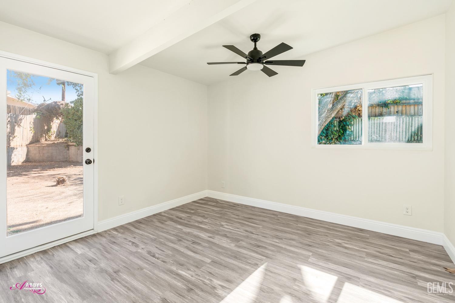 Undisclosed Address Bakersfield, CA 93306 - Photo 17 of 32 a view of a room with wooden floor and a window