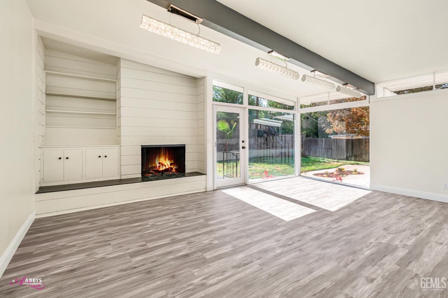 Undisclosed Address Bakersfield, CA 93306 - Photo 23 of 32 a view of an empty room with wooden floor and a window