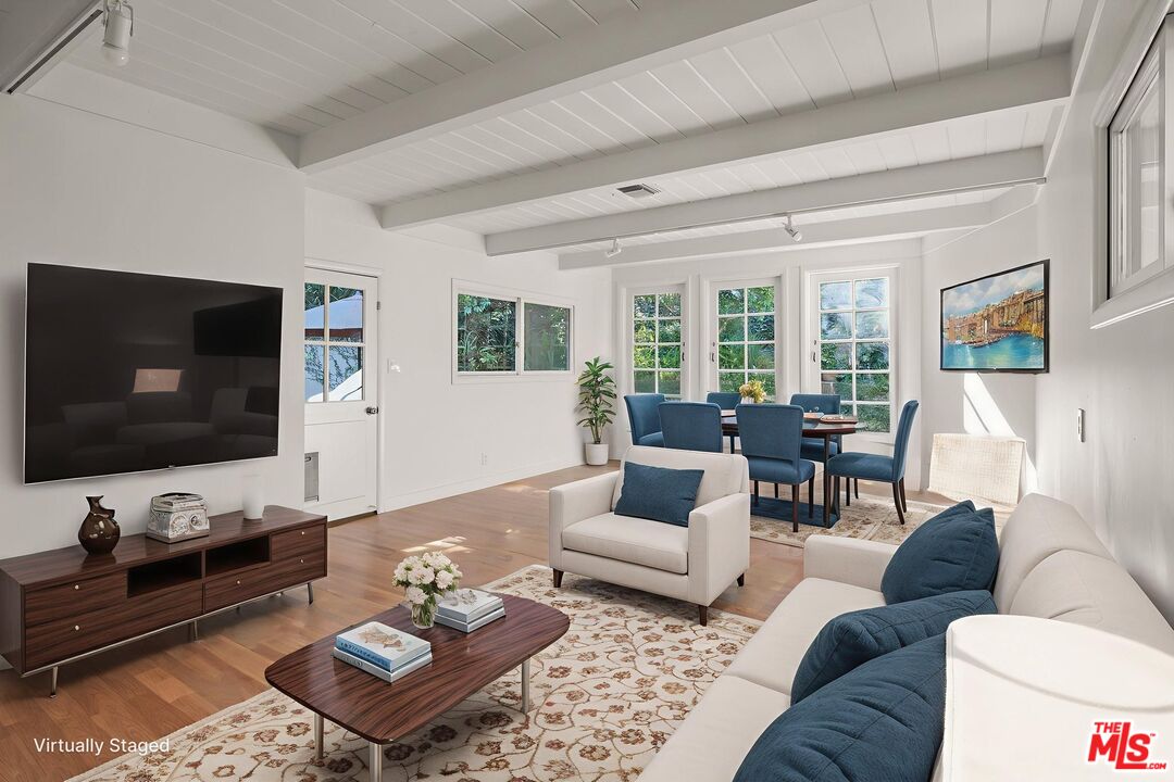 3621 Longview Valley Road Sherman Oaks, CA 91423 - Photo 12 of 25 a living room with furniture and a flat screen tv