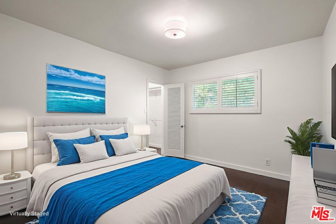 3621 Longview Valley Road Sherman Oaks, CA 91423 - Photo 14 of 25 a bedroom with a bed and a potted plant