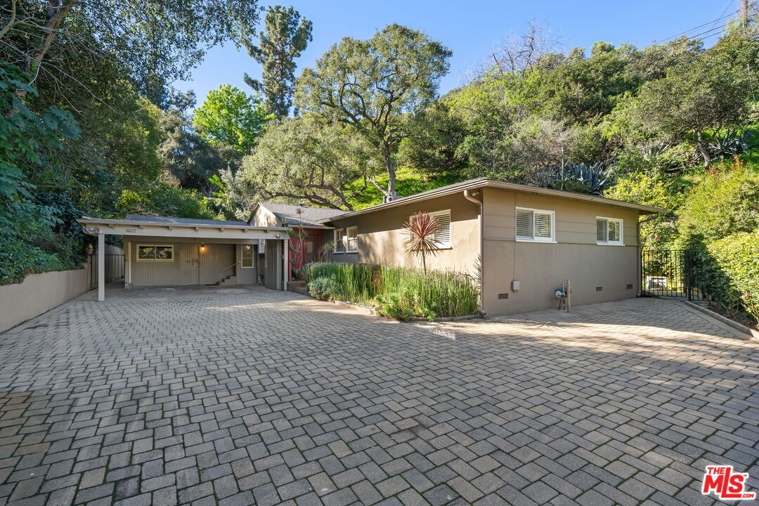 3621 Longview Valley Road Sherman Oaks, CA 91423 - Photo 3 of 25 a front view of house with yard and trees