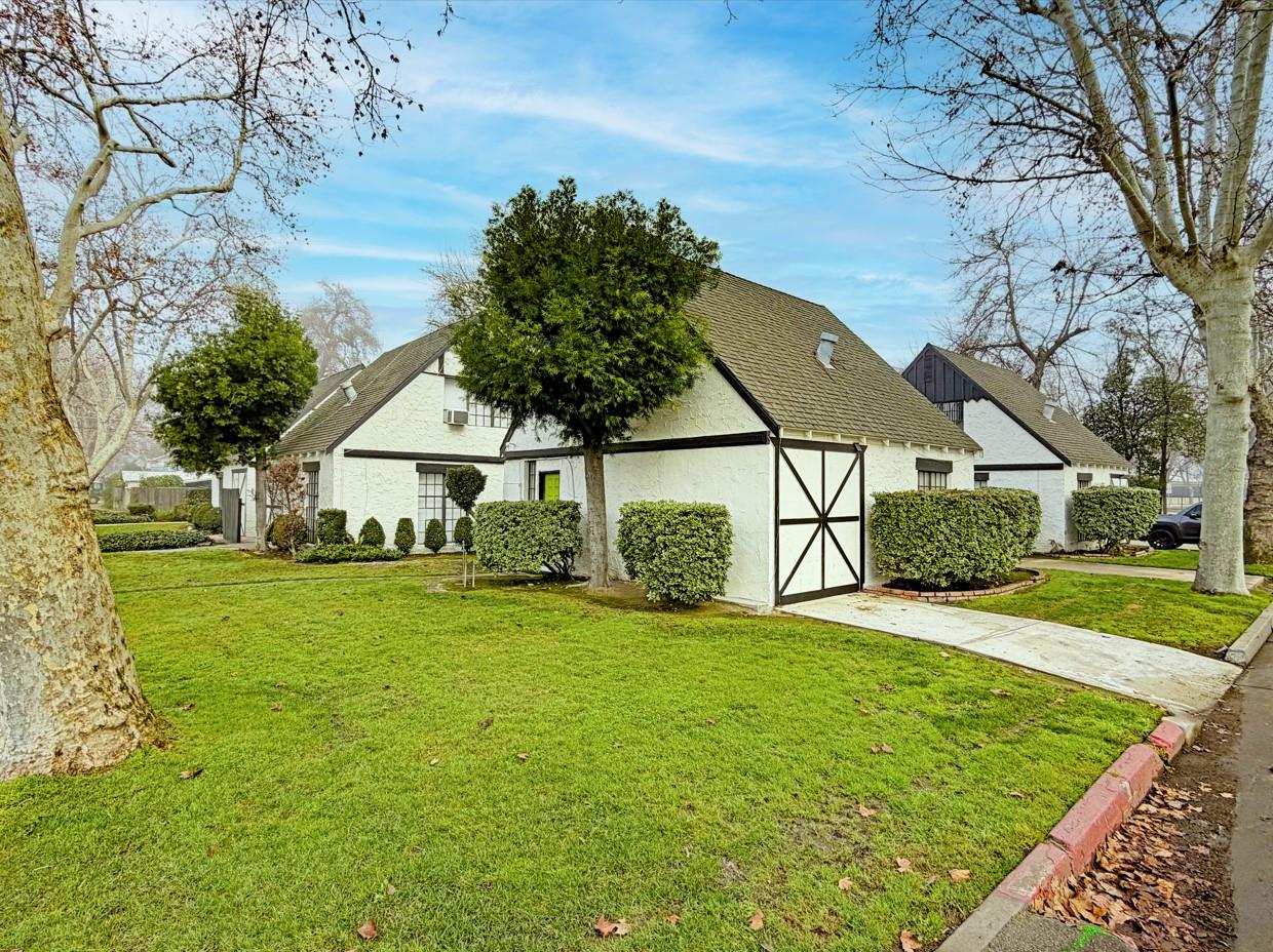 607 East Marshall Street Turlock, CA 95380 - Photo 3 of 9 a front view of house with yard and green space