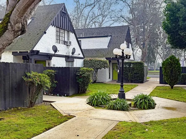 a front view of a house with garden