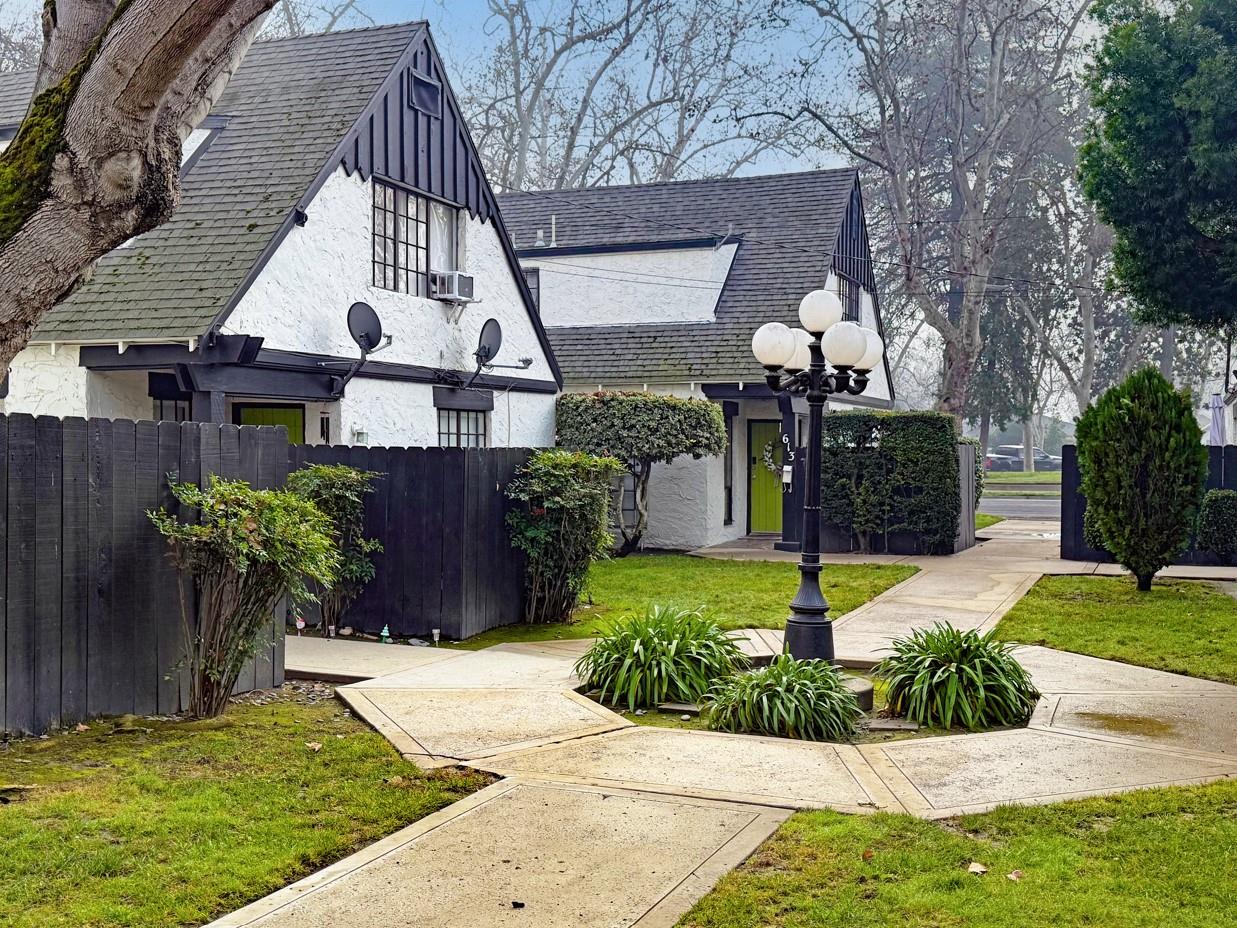 607 East Marshall Street Turlock, CA 95380 - Photo 4 of 9 a front view of a house with garden