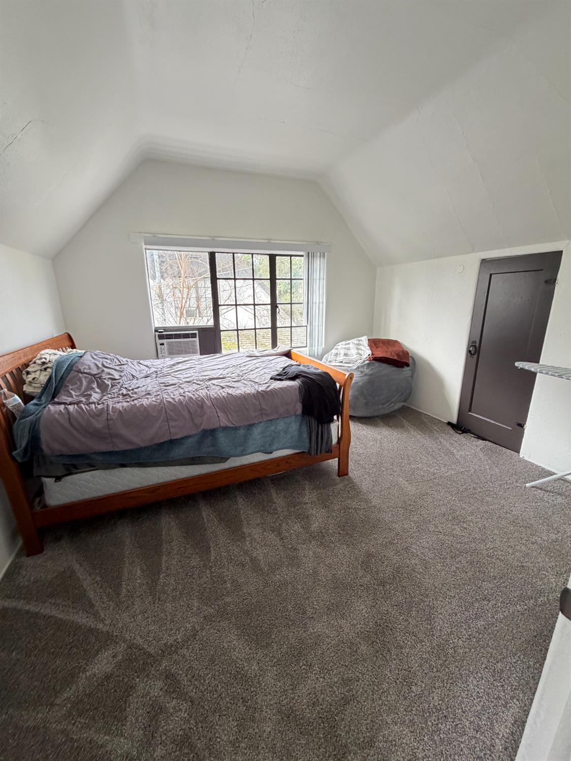 607 East Marshall Street Turlock, CA 95380 - Photo 7 of 9 a bedroom with a bed and window