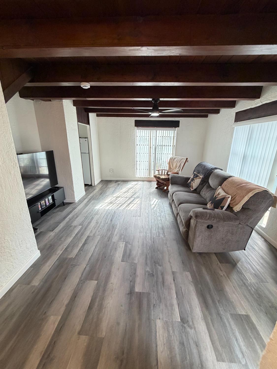 607 East Marshall Street Turlock, CA 95380 - Photo 8 of 9 a living room with furniture and a wooden floor