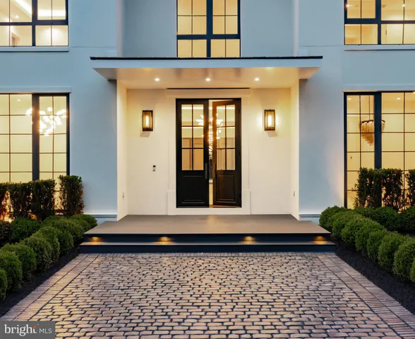 a view of a brick house with large windows