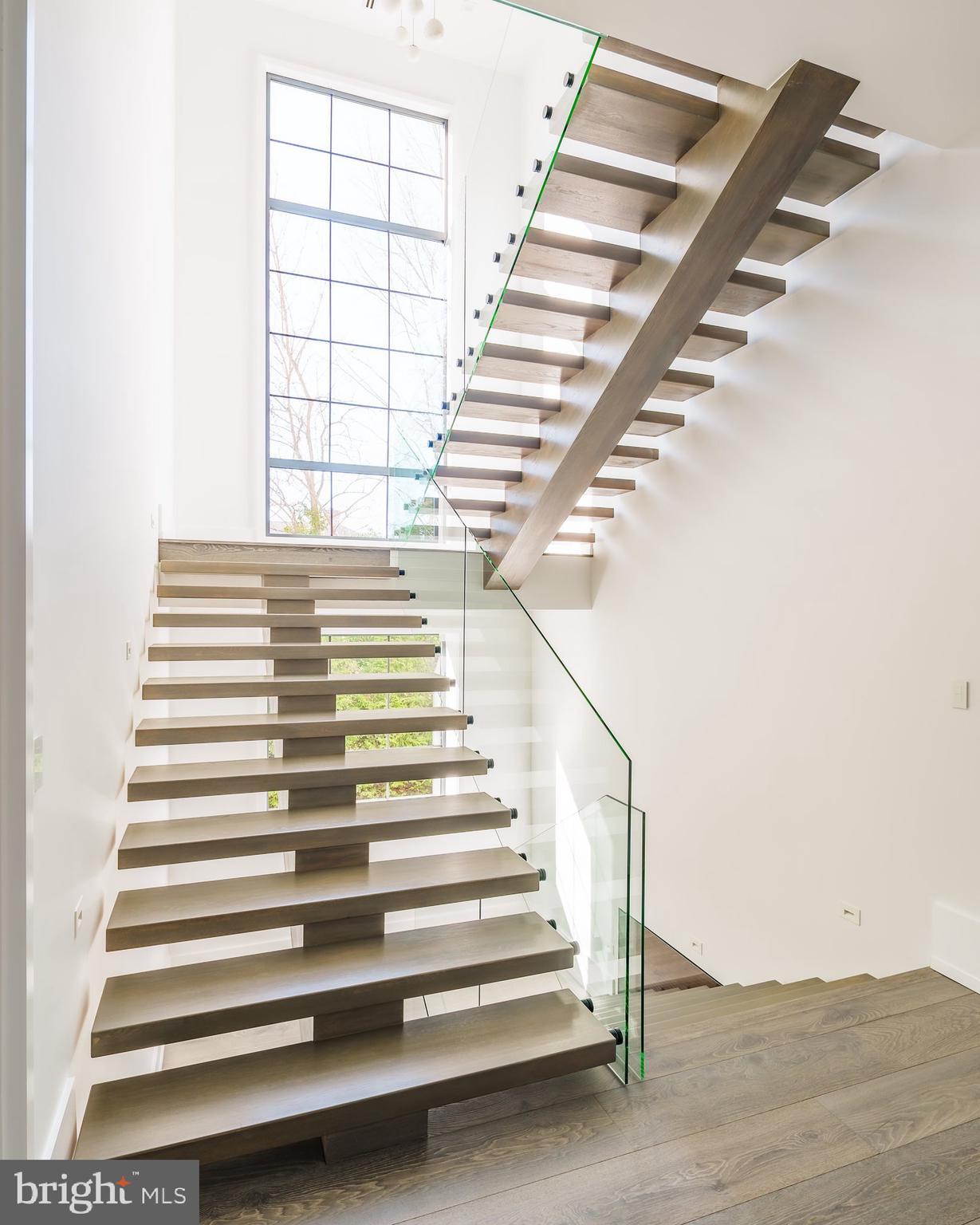 1102 Chain Bridge Road McLean, VA 22101 - Photo 26 of 50 a view of entryway and hall with wooden floor