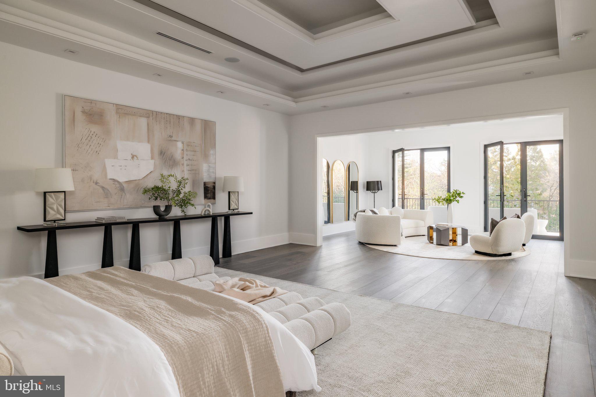 1102 Chain Bridge Road McLean, VA 22101 - Photo 28 of 50 a bedroom with a large bed and a large window