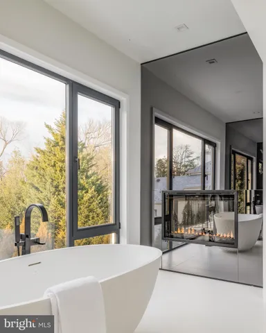 a view of a bathroom with a sink and mirror