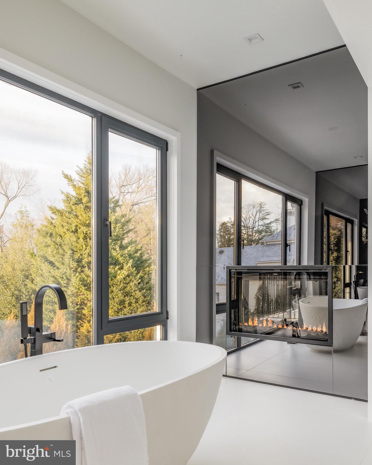 1102 Chain Bridge Road McLean, VA 22101 - Photo 32 of 50 a living room with large large windows