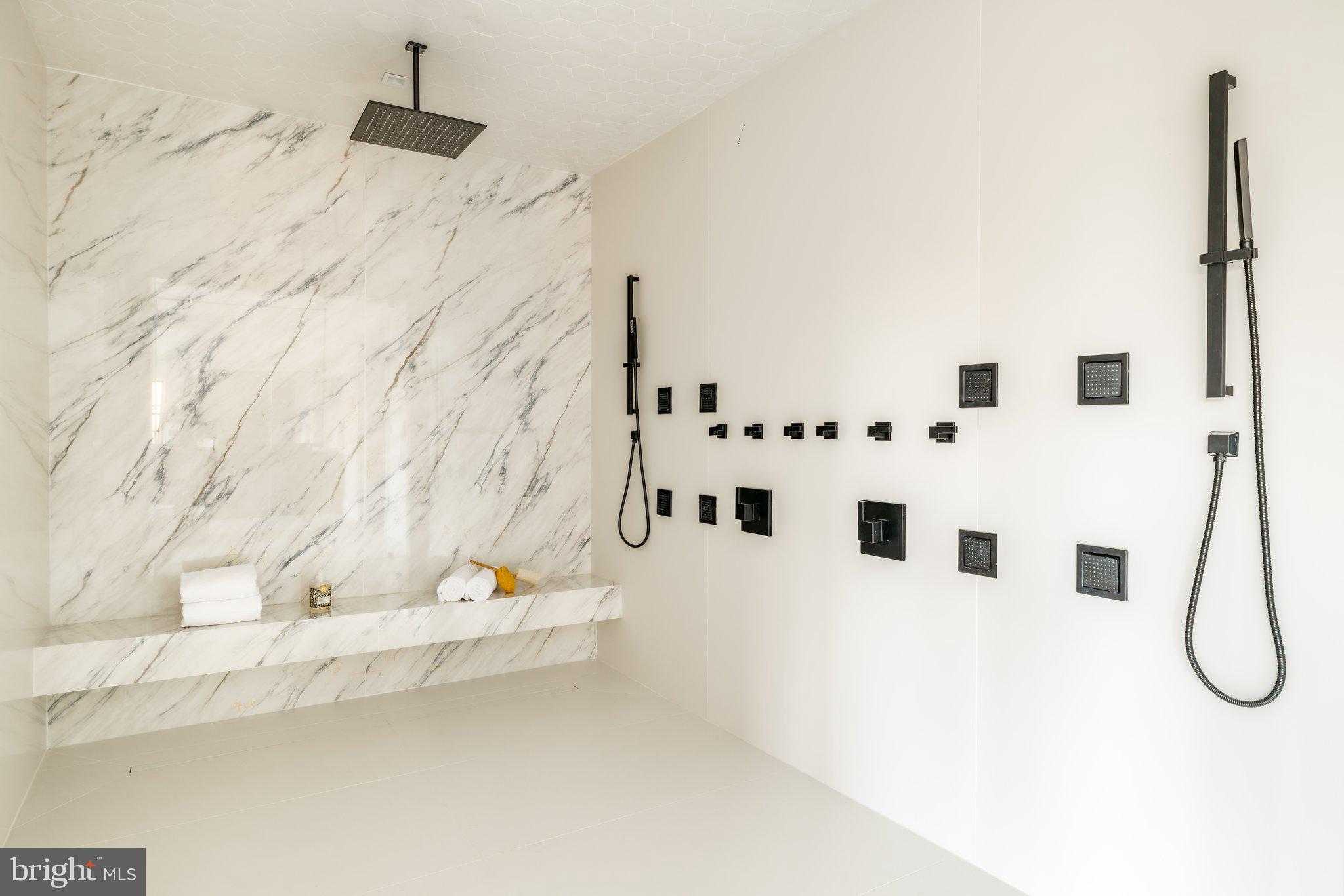 1102 Chain Bridge Road McLean, VA 22101 - Photo 34 of 50 a view of a bathroom with a sink and mirror
