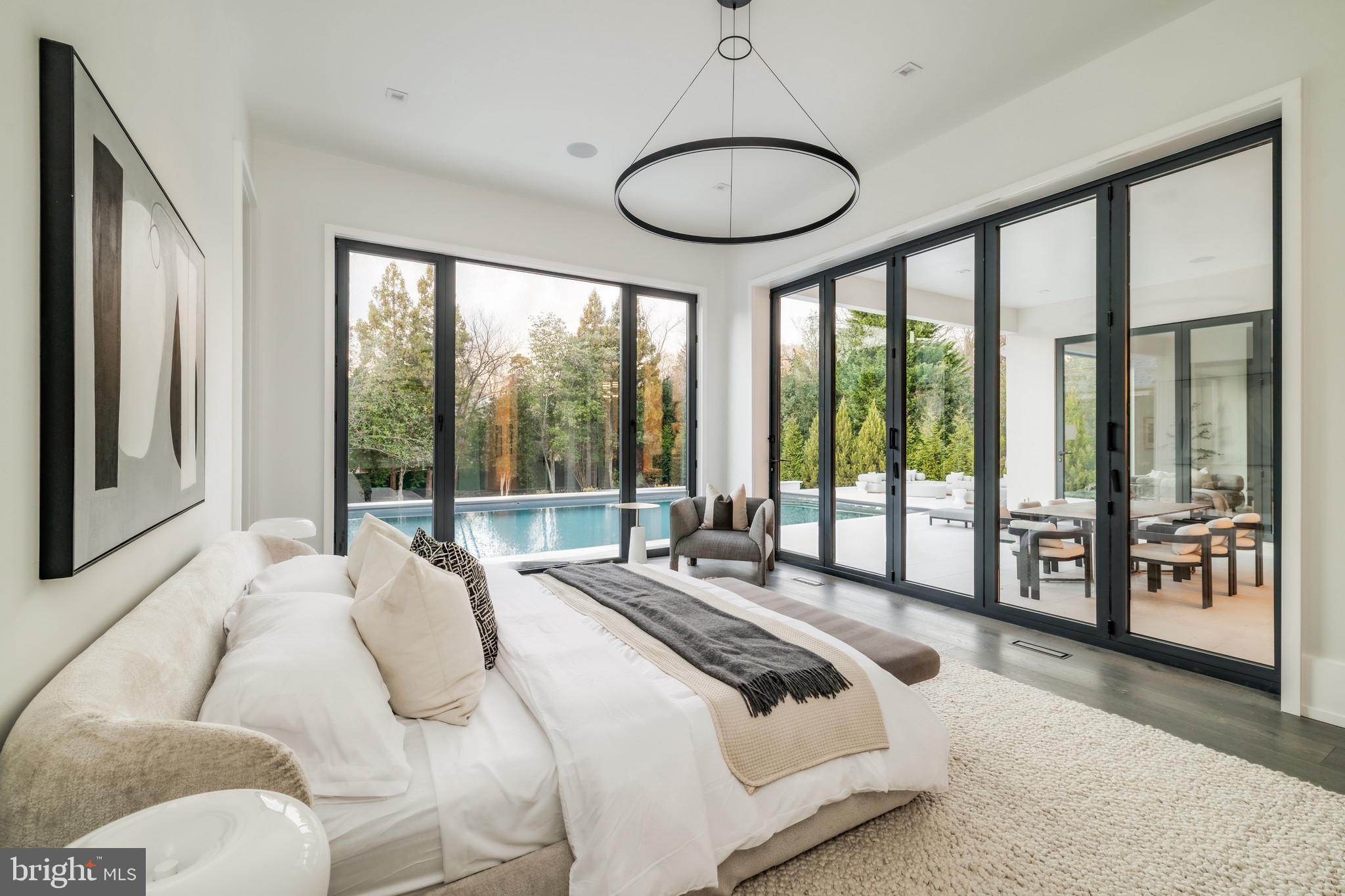 1102 Chain Bridge Road McLean, VA 22101 - Photo 39 of 50 a bedroom with a large bed and a large window