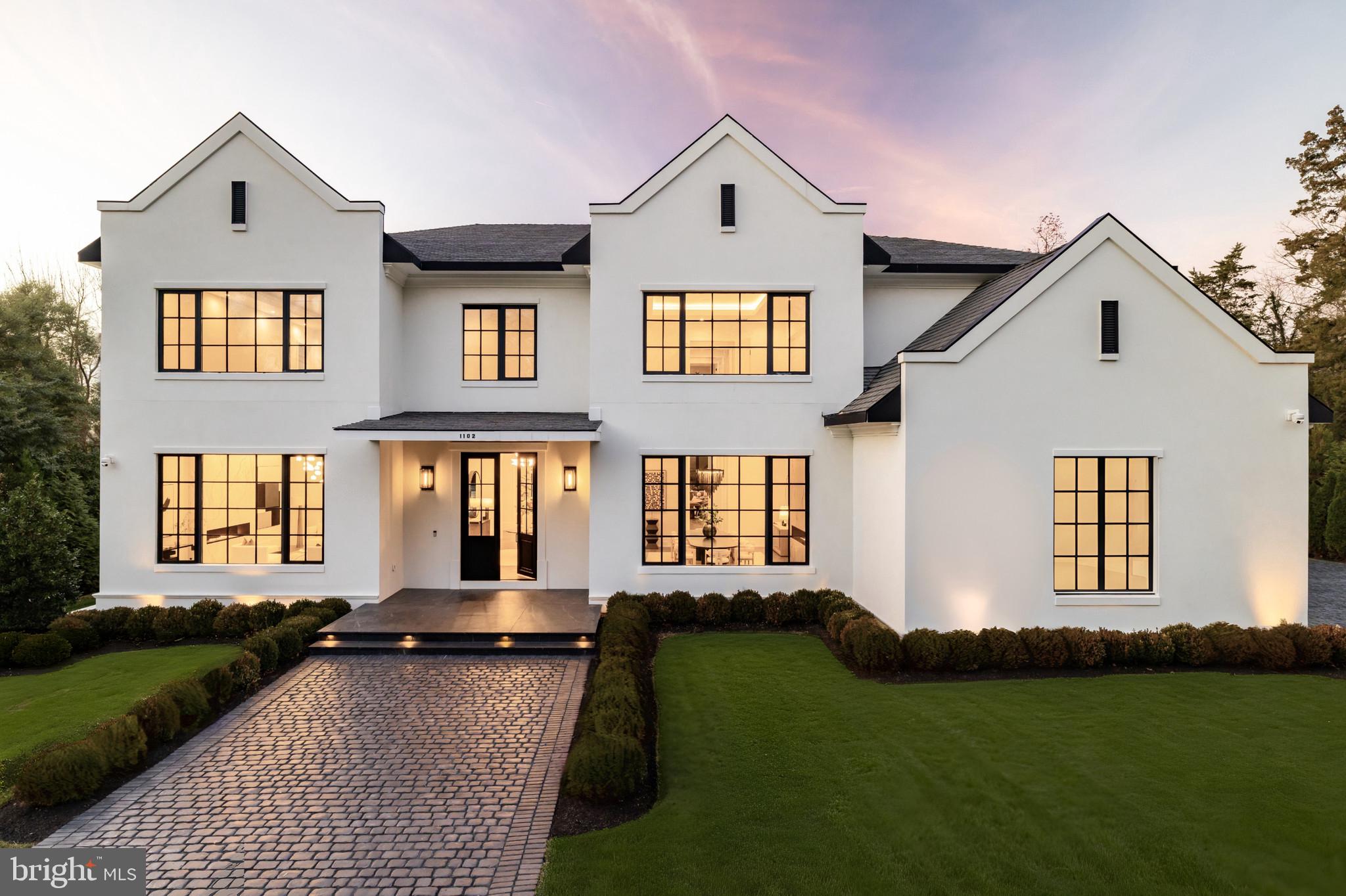 1102 Chain Bridge Road McLean, VA 22101 - Photo 50 of 50 a front view of a house with a yard