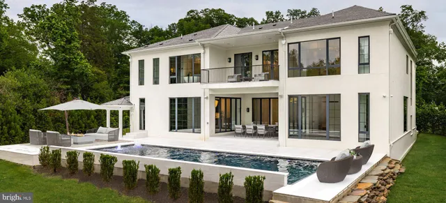 a view of a house with sitting area and garden