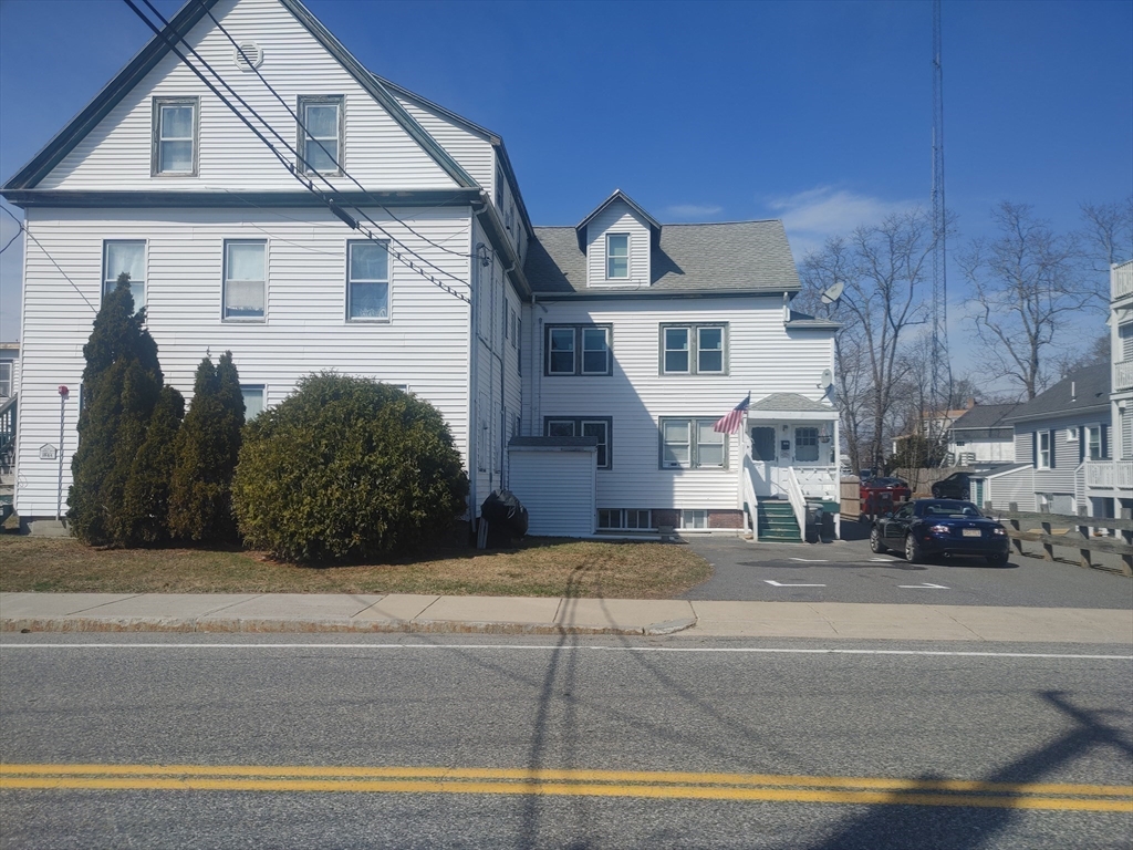 16 Wall Street, Unit 2 Foxboro, MA 02035 - Photo 21 of 25 a front view of a house with a garden