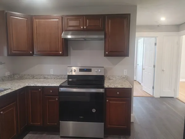 a kitchen with a stove and a sink