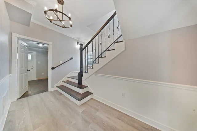 a bathroom with a sink a toilet and a shower