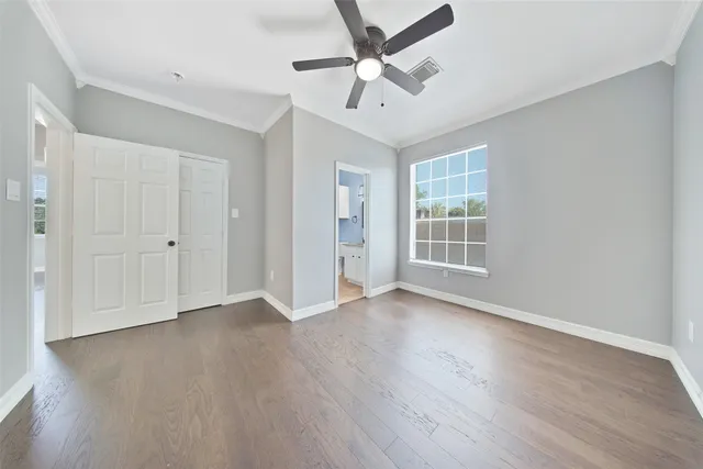 a bathroom with a granite countertop sink a toilet and a mirror